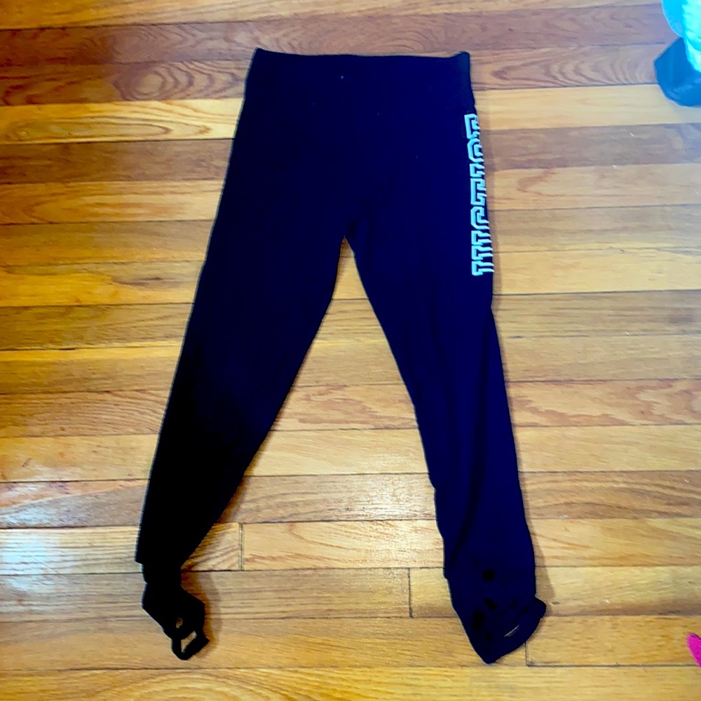 Justice black leggings with style rips on bottom of ankle